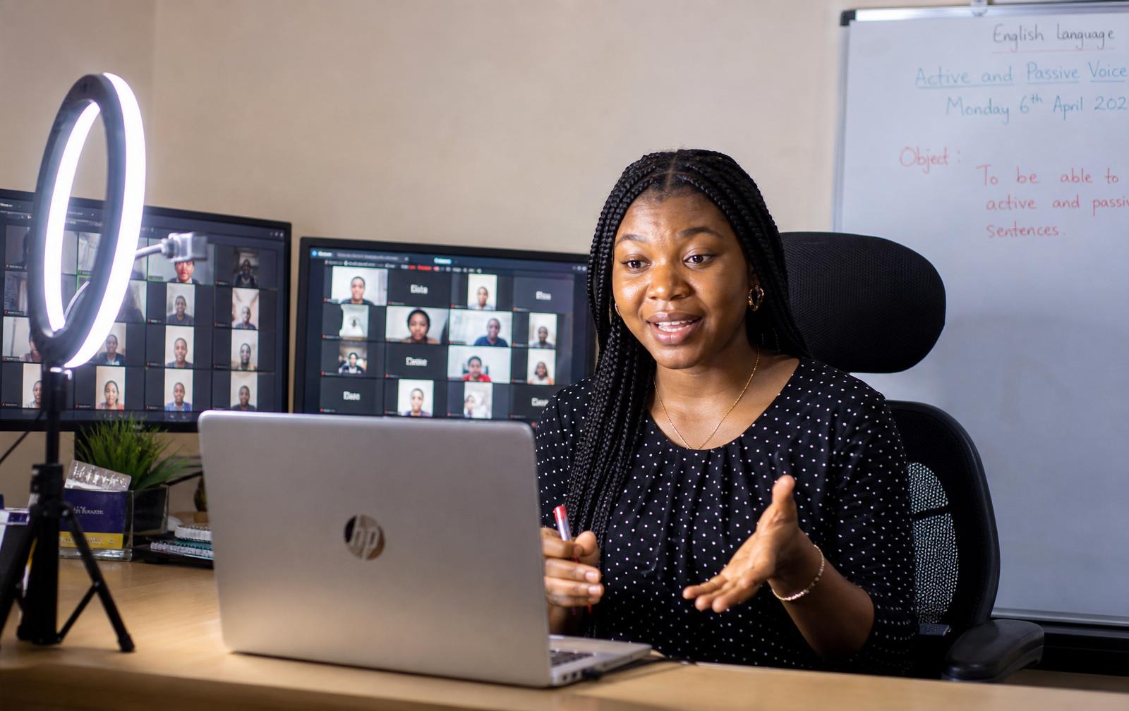 African facilitator hosting a virtual live class from home